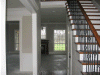 Front foyer and stairway and view of den/family room